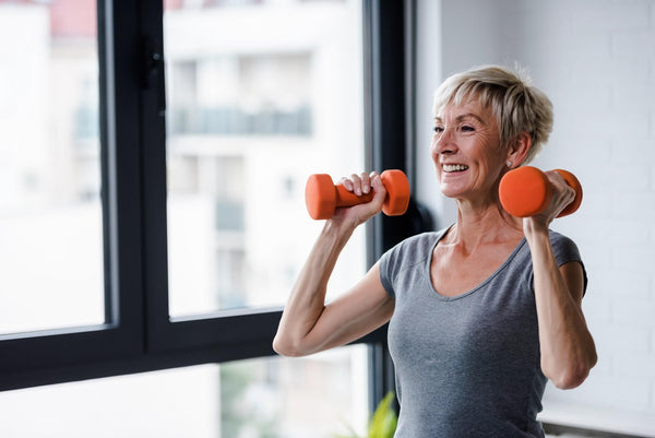 Portrait,Of,Senior,Woman,Lifting,Dumbbells