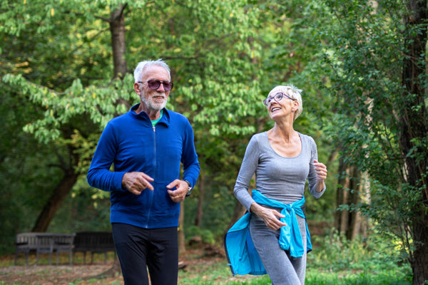 Mature,Couple,Man,And,Woman,Jogging,In,The,Park