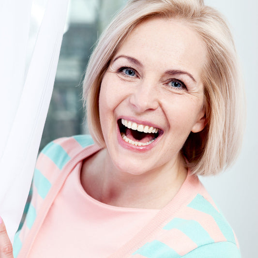Portrait,Beautiful,Middle,Aged,Woman,Smiling,Friendly,And,Looking,Into