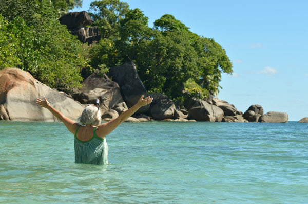Senior,Woman,Swimming,In,Sea